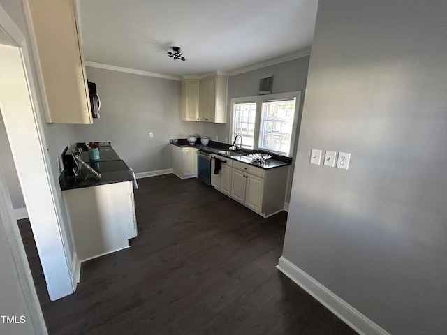 kitchen featuring sink, crown molding, dark hardwood / wood-style floors, appliances with stainless steel finishes, and white cabinetry