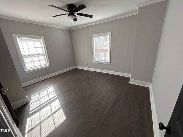 empty room featuring ceiling fan, dark hardwood / wood-style flooring, and ornamental molding