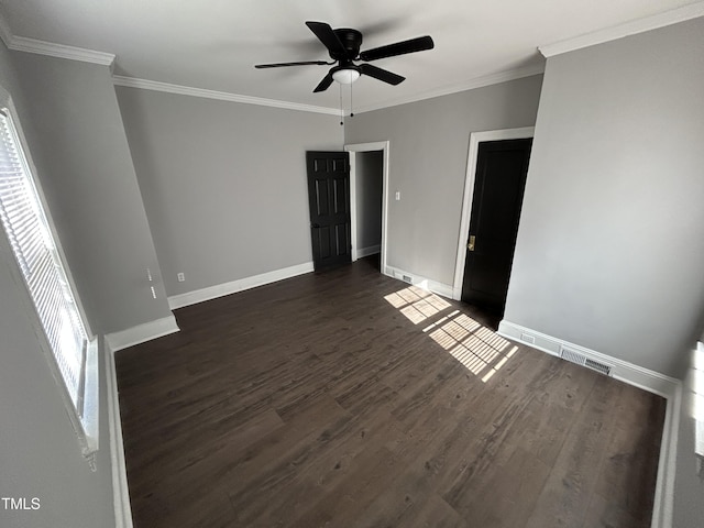 unfurnished room featuring crown molding, dark hardwood / wood-style flooring, and ceiling fan