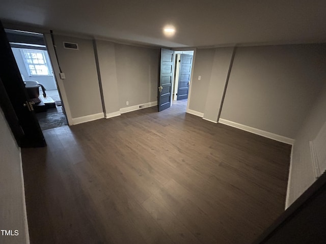 basement featuring dark hardwood / wood-style floors