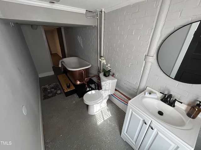 bathroom featuring crown molding, vanity, and toilet