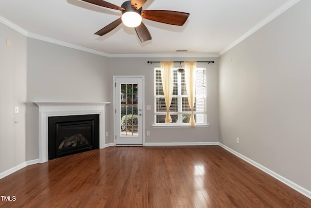 unfurnished living room featuring hardwood / wood-style flooring, ceiling fan, and crown molding