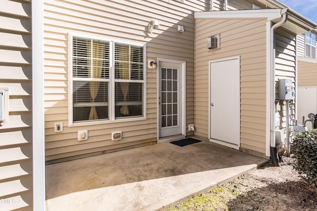 entrance to property with a patio area