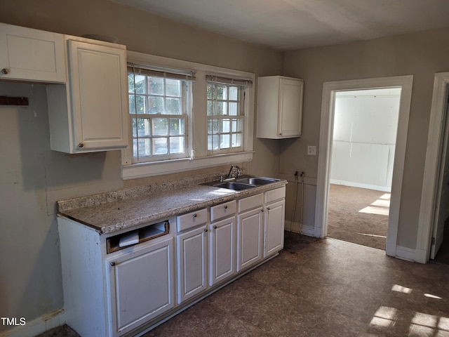 kitchen with sink and white cabinets