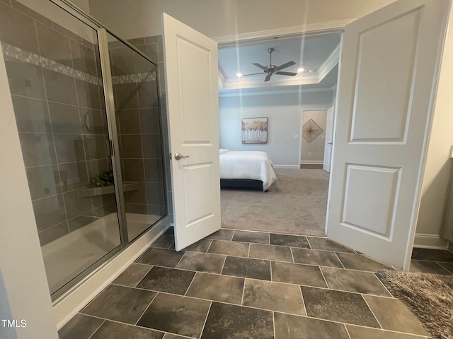 bathroom with a tray ceiling, ornamental molding, a ceiling fan, connected bathroom, and a shower stall