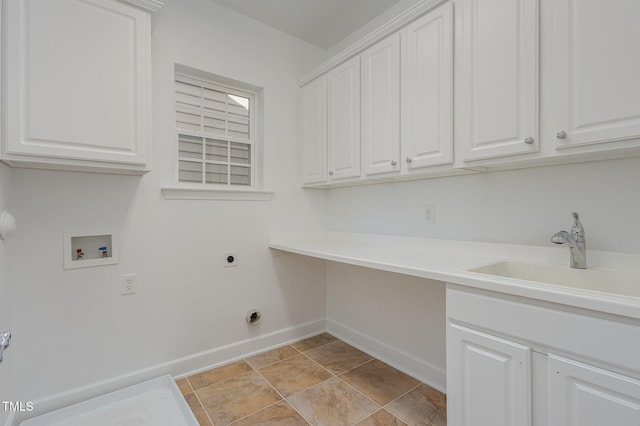 clothes washing area with electric dryer hookup, cabinets, sink, and hookup for a washing machine