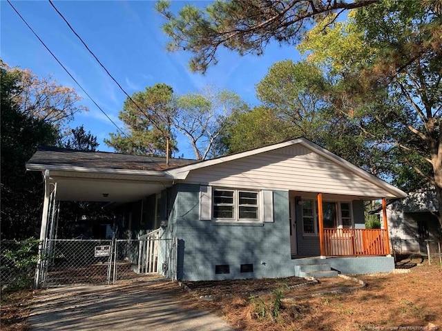 view of front facade featuring a porch and a carport