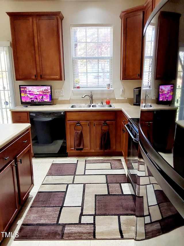 kitchen featuring black appliances and sink