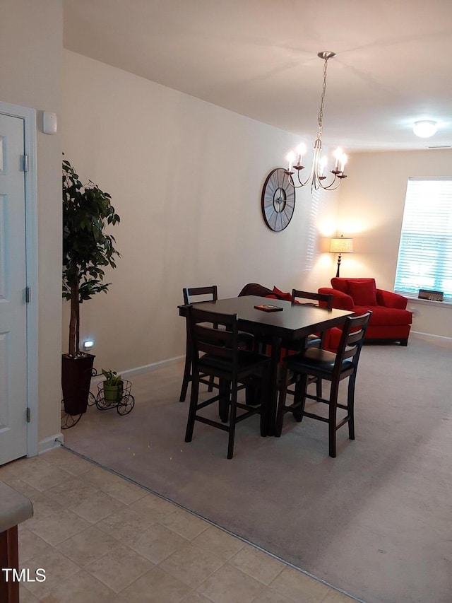 dining area featuring an inviting chandelier