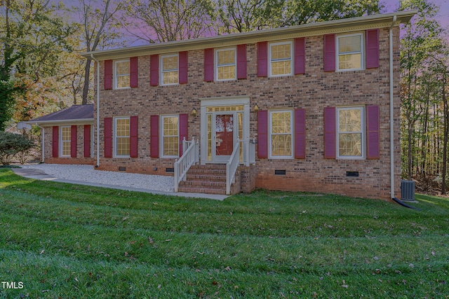 colonial inspired home with a front yard