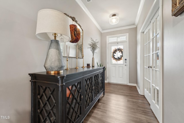 entryway with dark wood-type flooring and ornamental molding