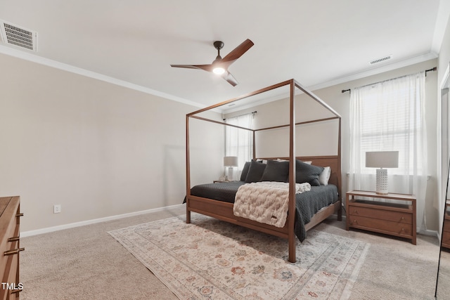 bedroom with multiple windows, ceiling fan, crown molding, and light carpet