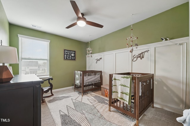 carpeted bedroom with a crib