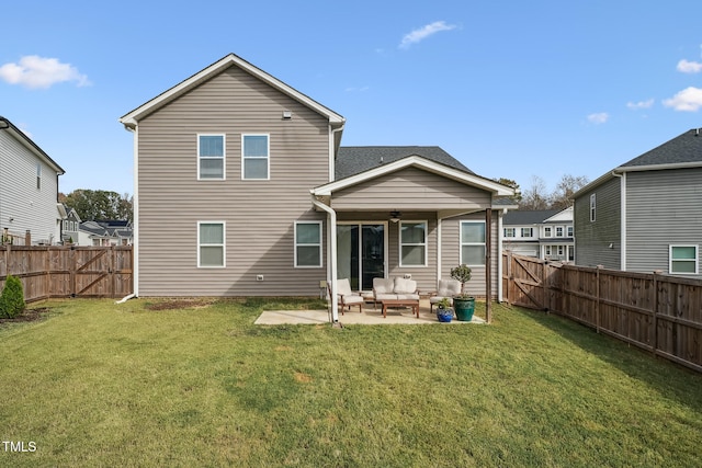 back of property featuring a patio, an outdoor hangout area, ceiling fan, and a lawn