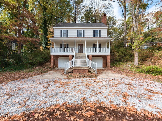 view of front of home featuring a garage and covered porch