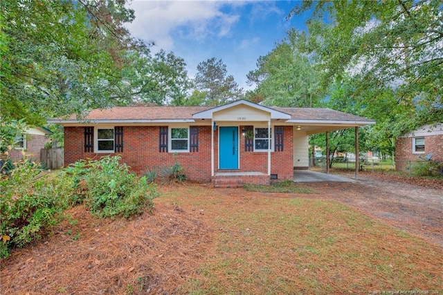 single story home with a carport