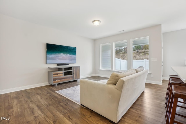 living room featuring dark wood-type flooring