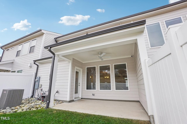 exterior space with ceiling fan, a patio area, and central AC