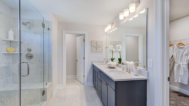 bathroom with walk in shower, tile patterned flooring, and vanity