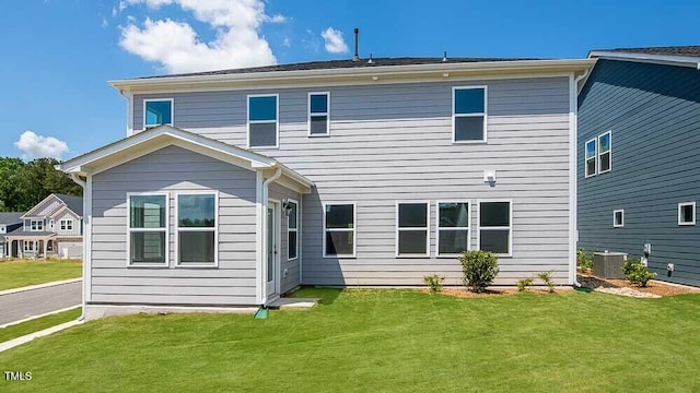 657 Sun Meadow Dr, Wake Forest, NC 27587 - back of house with central AC and a lawn