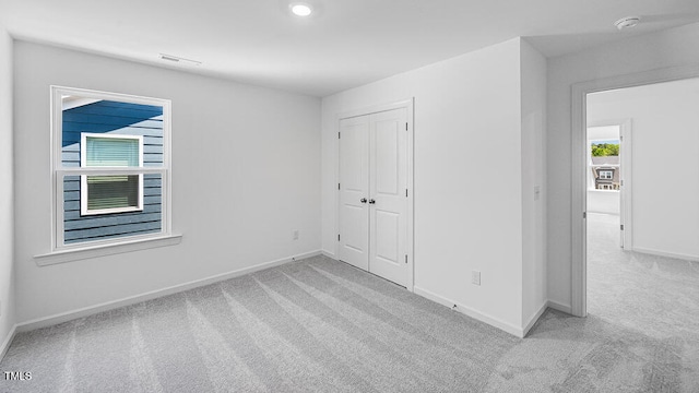 657 Sun Meadow Dr, Wake Forest, NC 27587 - unfurnished bedroom featuring carpet flooring, baseboards, a closet, and recessed lighting