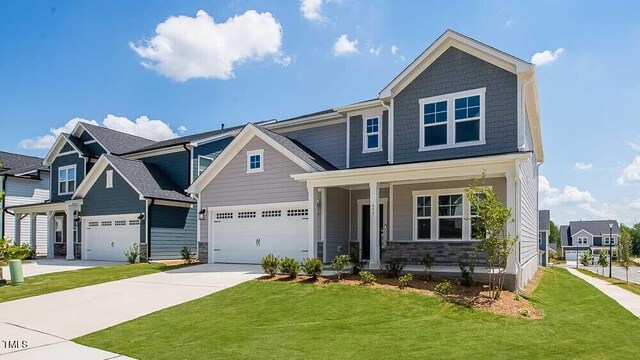 657 Sun Meadow Dr, Wake Forest, NC 27587 - craftsman inspired home featuring driveway, a front lawn, and a porch