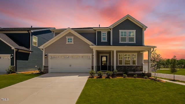 657 Sun Meadow Dr, Wake Forest, NC 27587 - craftsman house with concrete driveway, a front yard, a porch, and stone siding