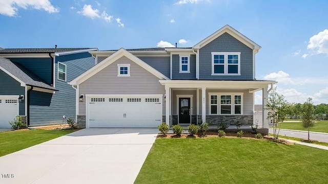 657 Sun Meadow Dr, Wake Forest, NC 27587 - craftsman house featuring concrete driveway, a front yard, a garage, and stone siding