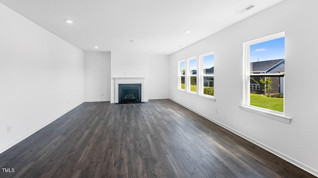 657 Sun Meadow Dr, Wake Forest, NC 27587 - unfurnished living room featuring dark wood-style flooring, a fireplace with flush hearth, baseboards, and recessed lighting