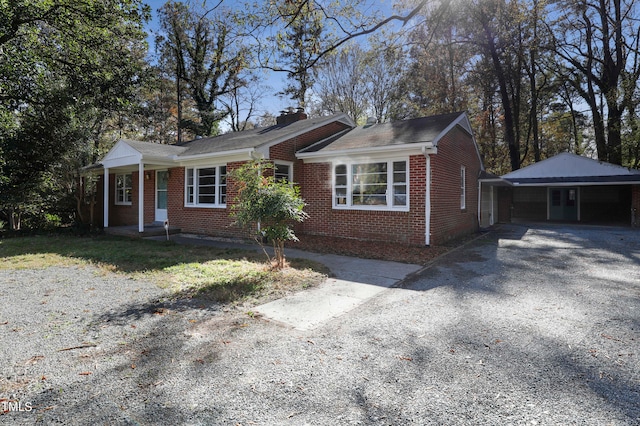 single story home featuring a carport