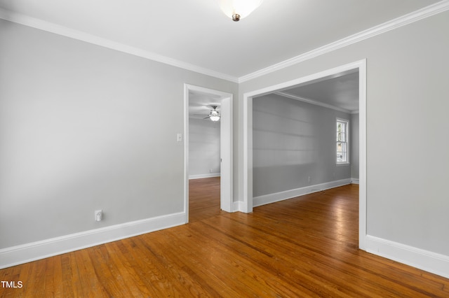 unfurnished room with ornamental molding, hardwood / wood-style floors, and ceiling fan