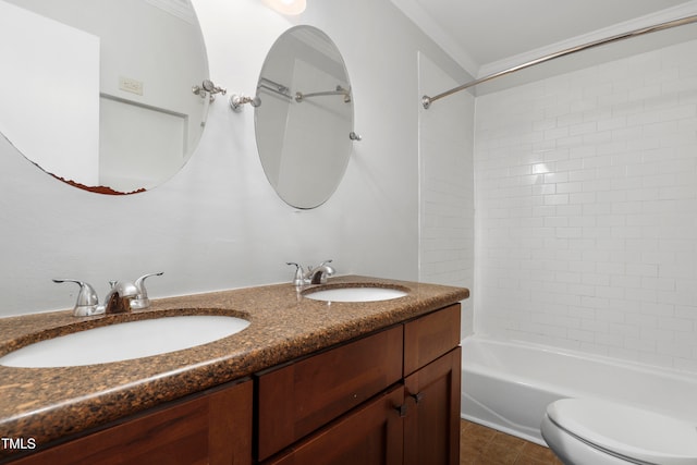 full bathroom with tile patterned floors, toilet, tiled shower / bath combo, ornamental molding, and vanity