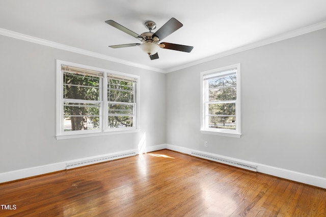 empty room with a baseboard heating unit, wood-type flooring, ceiling fan, and crown molding