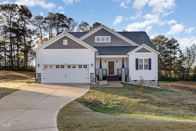 craftsman inspired home featuring a front lawn and a garage