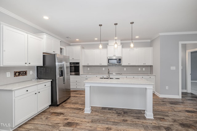 kitchen featuring appliances with stainless steel finishes, sink, pendant lighting, dark hardwood / wood-style floors, and white cabinetry