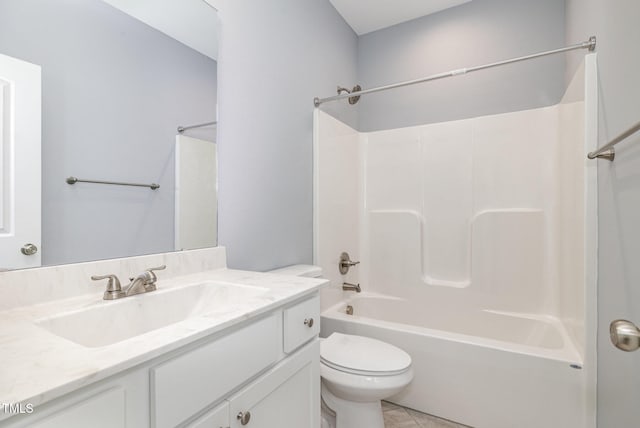 full bathroom featuring toilet, vanity, tile patterned floors, and  shower combination