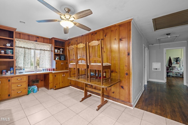 office space featuring ceiling fan and ornamental molding