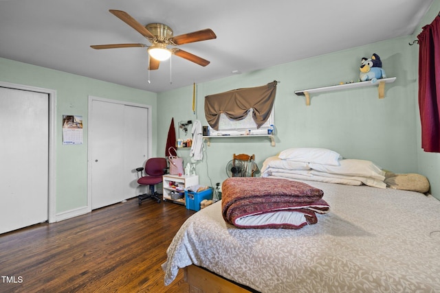 bedroom with dark hardwood / wood-style flooring and ceiling fan