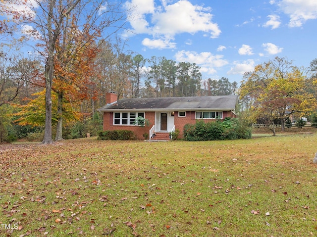 ranch-style house with a front lawn