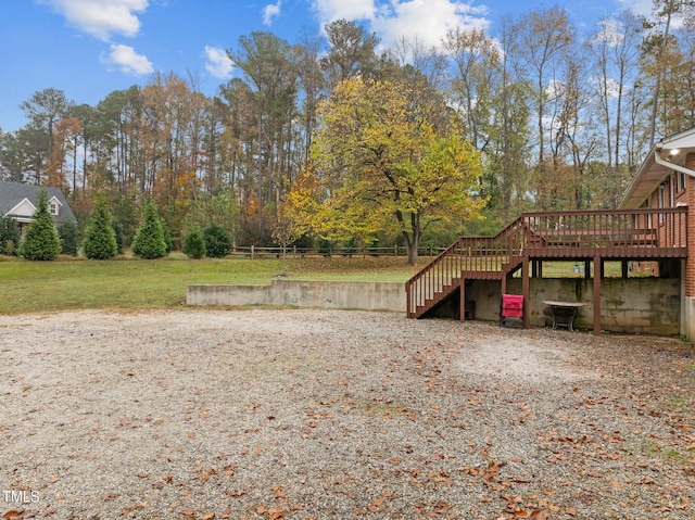 view of yard with a wooden deck