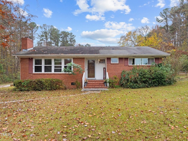 ranch-style home with a front lawn