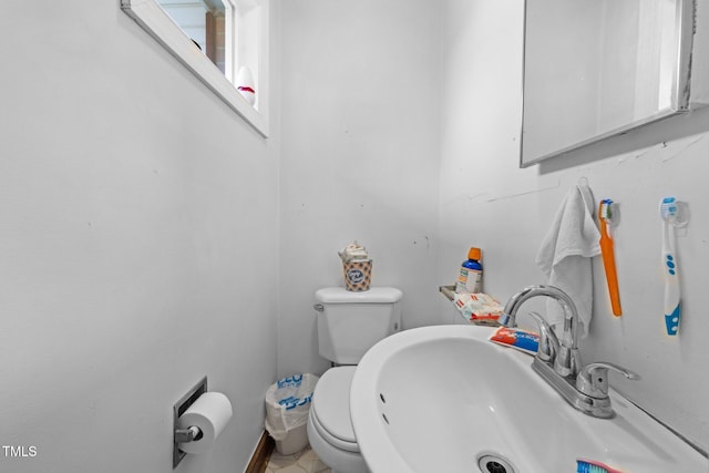 bathroom with toilet and sink