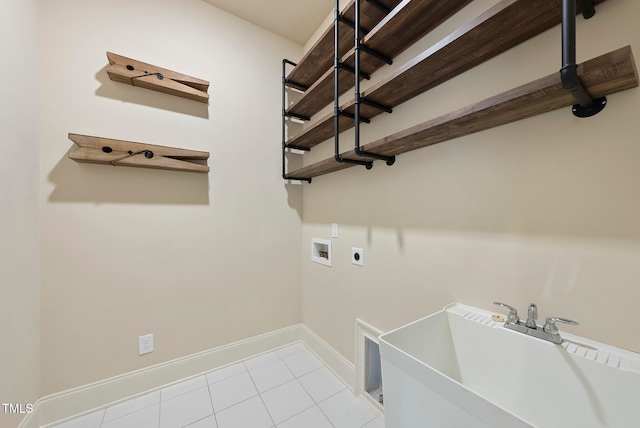 washroom featuring hookup for a washing machine, light tile patterned floors, electric dryer hookup, and sink