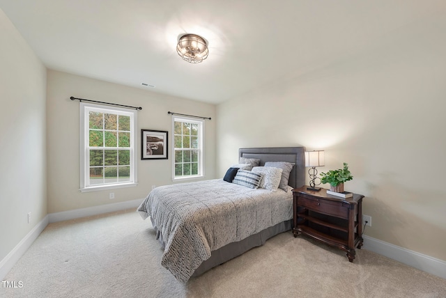 bedroom with light carpet