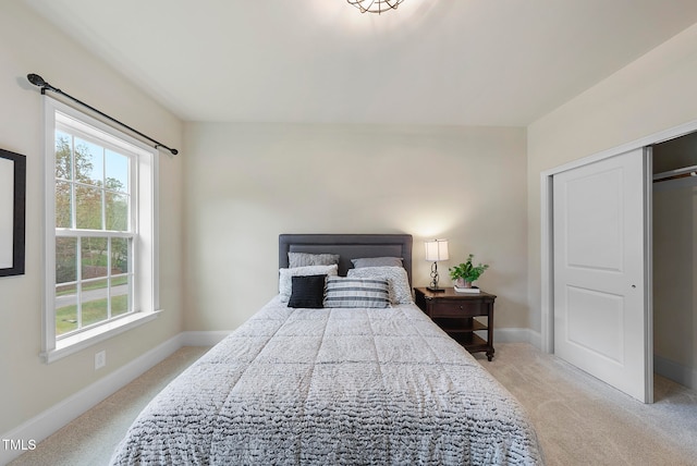 carpeted bedroom featuring a closet