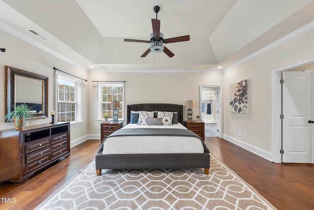 bedroom with hardwood / wood-style flooring, ceiling fan, and crown molding