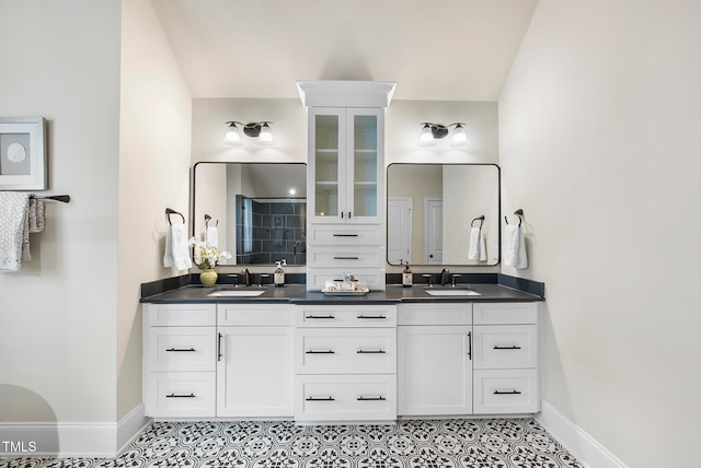 bathroom with tile patterned floors and vanity