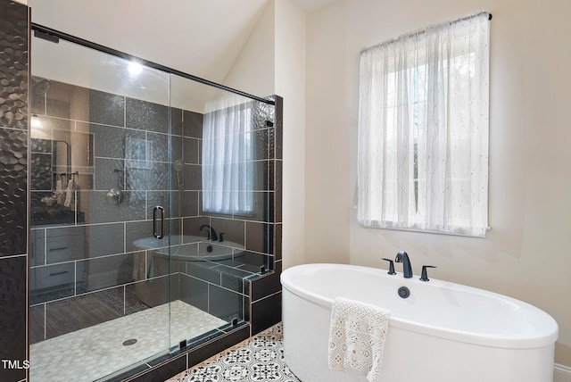 bathroom featuring separate shower and tub