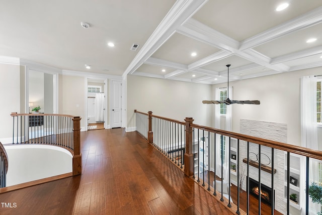 hall with beam ceiling, dark hardwood / wood-style flooring, ornamental molding, and coffered ceiling