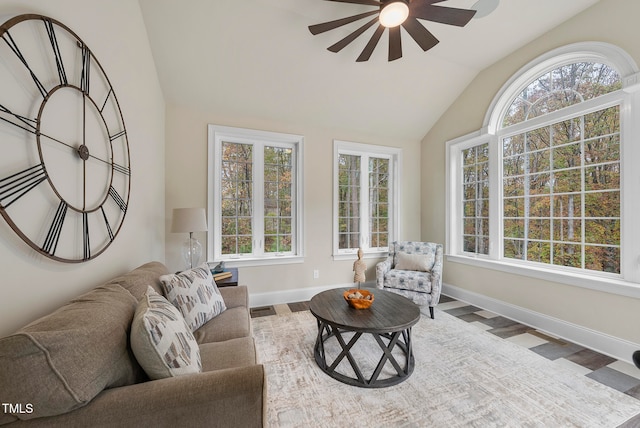 living room featuring hardwood / wood-style flooring, ceiling fan, and lofted ceiling